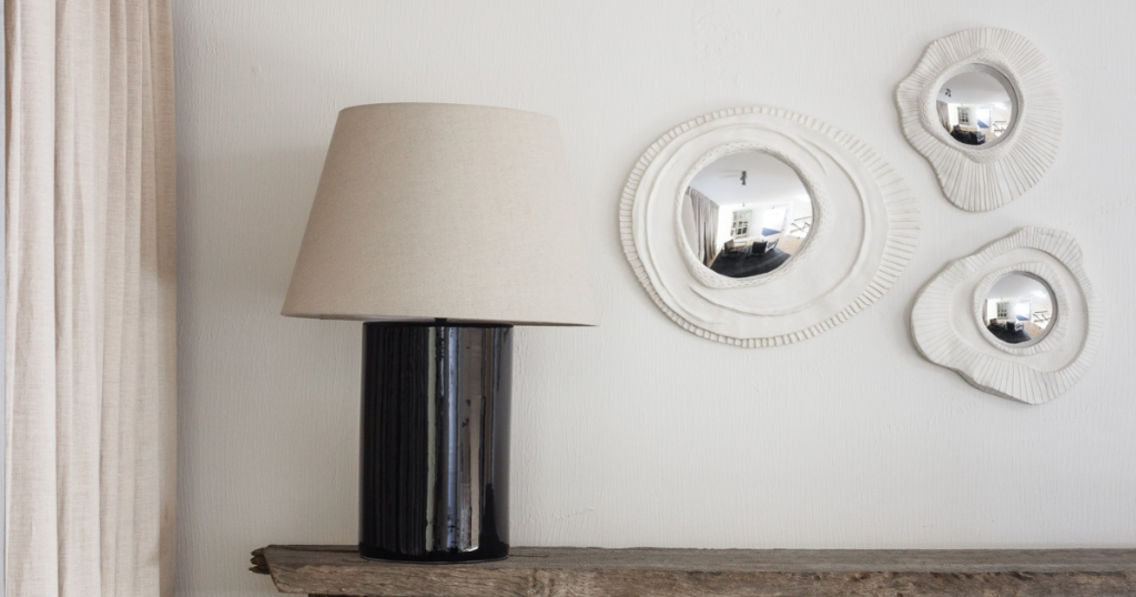 These hand sculpted mirrors are the perfect addition to our hallways